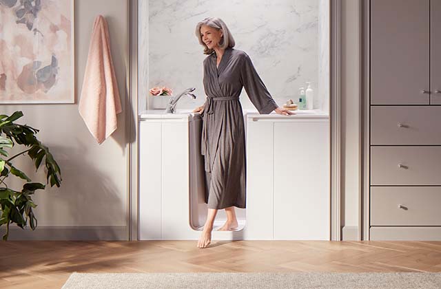 woman stepping out of bath smiling