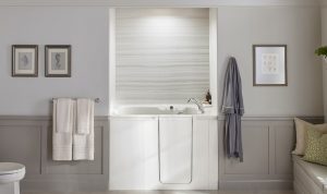 KOHLER Walk-In Bath with VeinCut Dune pattern bath walls.