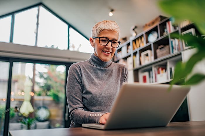 Woman working on computer at home