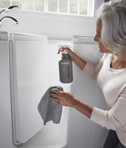 Photo of model cleaning KWIB surfaces with KOHLER Cleaner