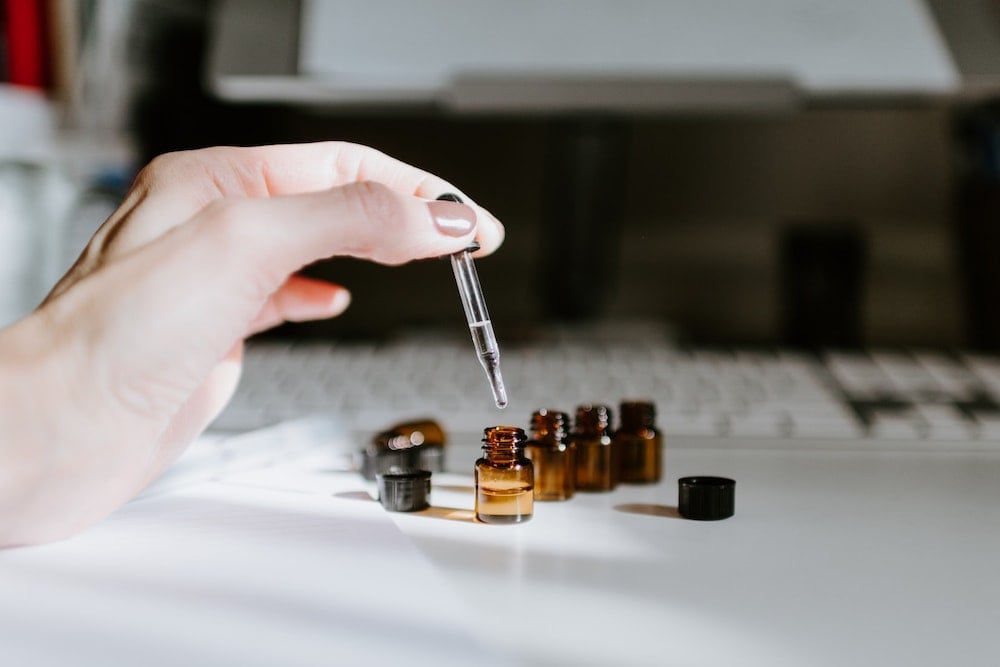 Essential oil bottles beings filled