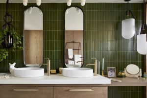 Bathroom with green walls and wooden sink