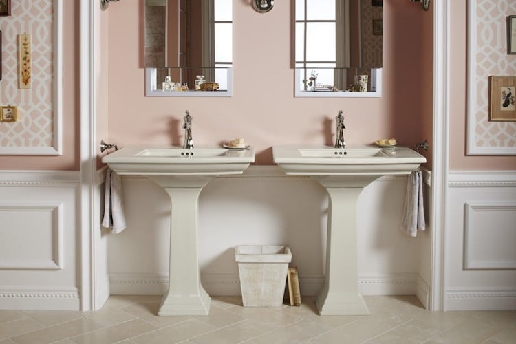 Bathroom with pink walls and white sinks