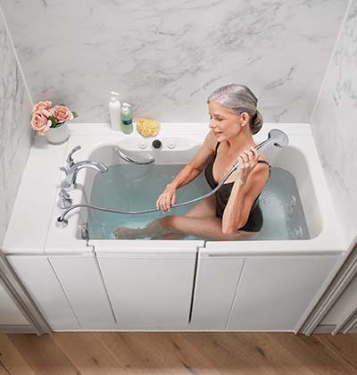 woman bathing with handshower