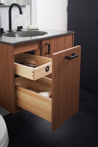 Wooden bathroom drawers open