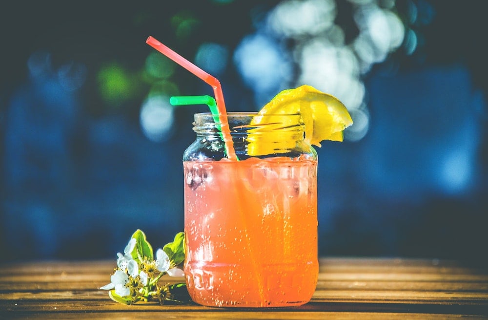 cold orange drink in mason jar