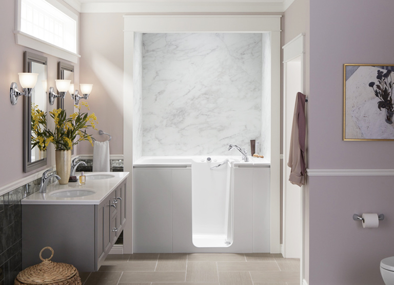 KOHLER® Walk-In Bath with Calacatta Crema bath walls