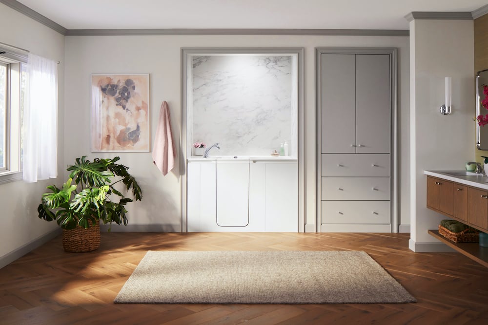 Large bathroom featuring the KOHLER Walk-In Bath with Calacatta Crema walls.