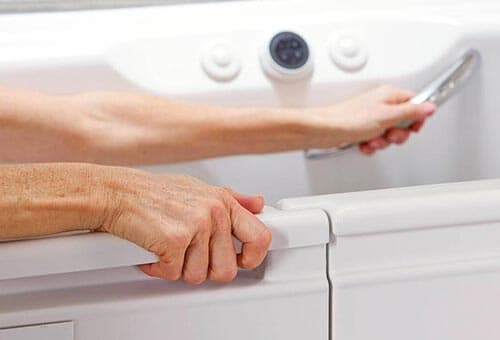 person using bath handrails