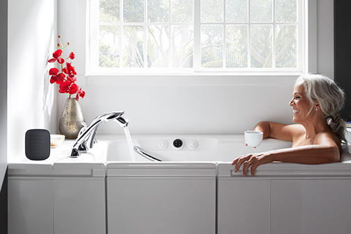 Woman drinking coffee in a Walk-In Bath.