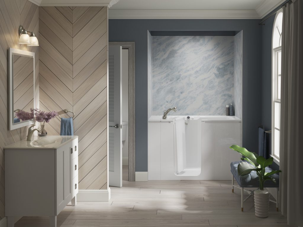 Large bathroom with large vanity and sink on the left of the image and a window to the right of the image with a walk-in tub custom-fit in the back bathroom wall.