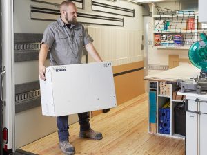 KOHLER Expert carrying a KOHLER box