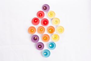 tea light candles with various colors including purple, yellow, red, orange, and blue in a diamond shape