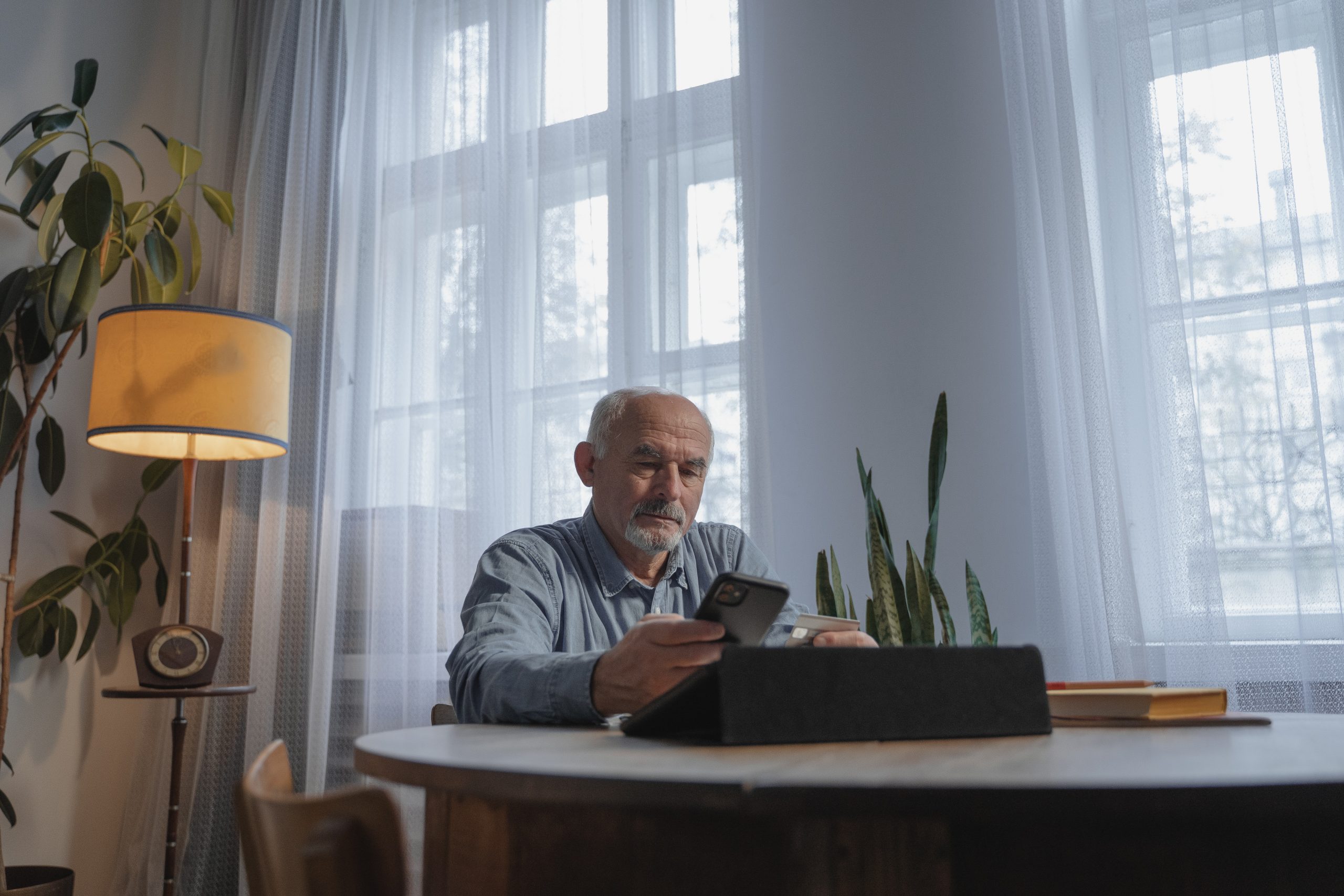 Man making a credit card purchase via mobile phone