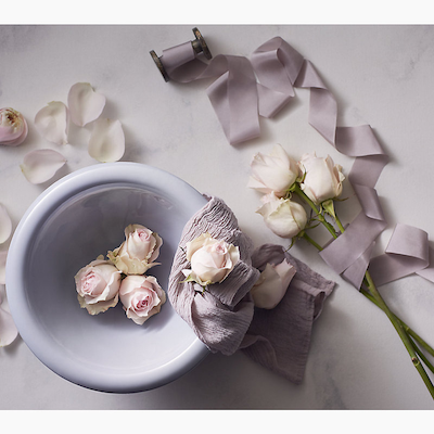 light purple bowl sink with roses in it for your luxury shower experience.