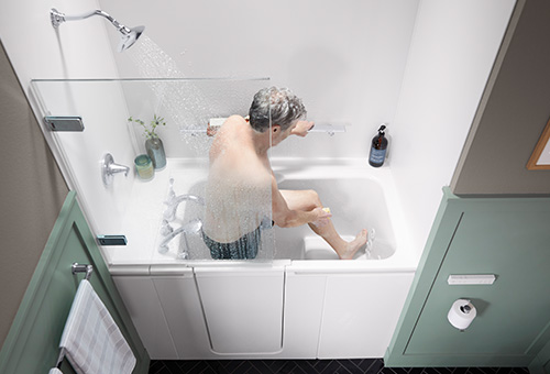 man using grab bar in shower